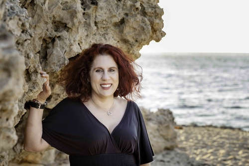 picture of author standing near rock formations on the beach at Point Peron