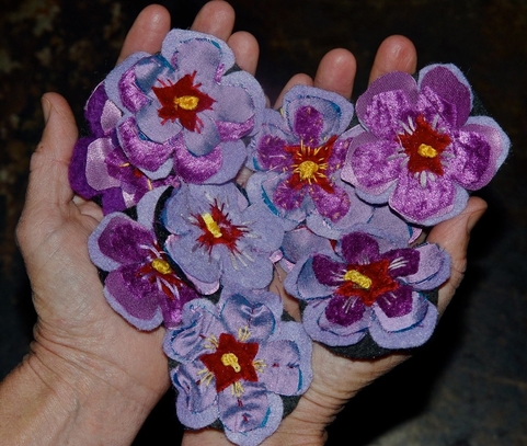 sorry day flowers australia, arranged in a heart shape, being held by two hands